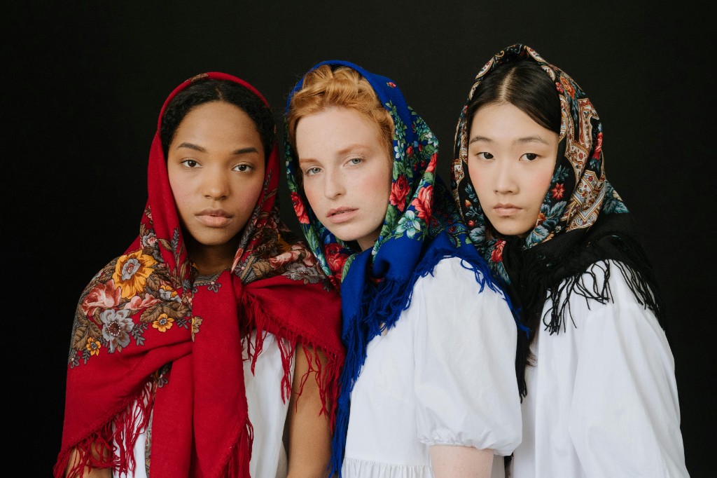 Lifestyle — three models in patterned headscarves, studio portrait